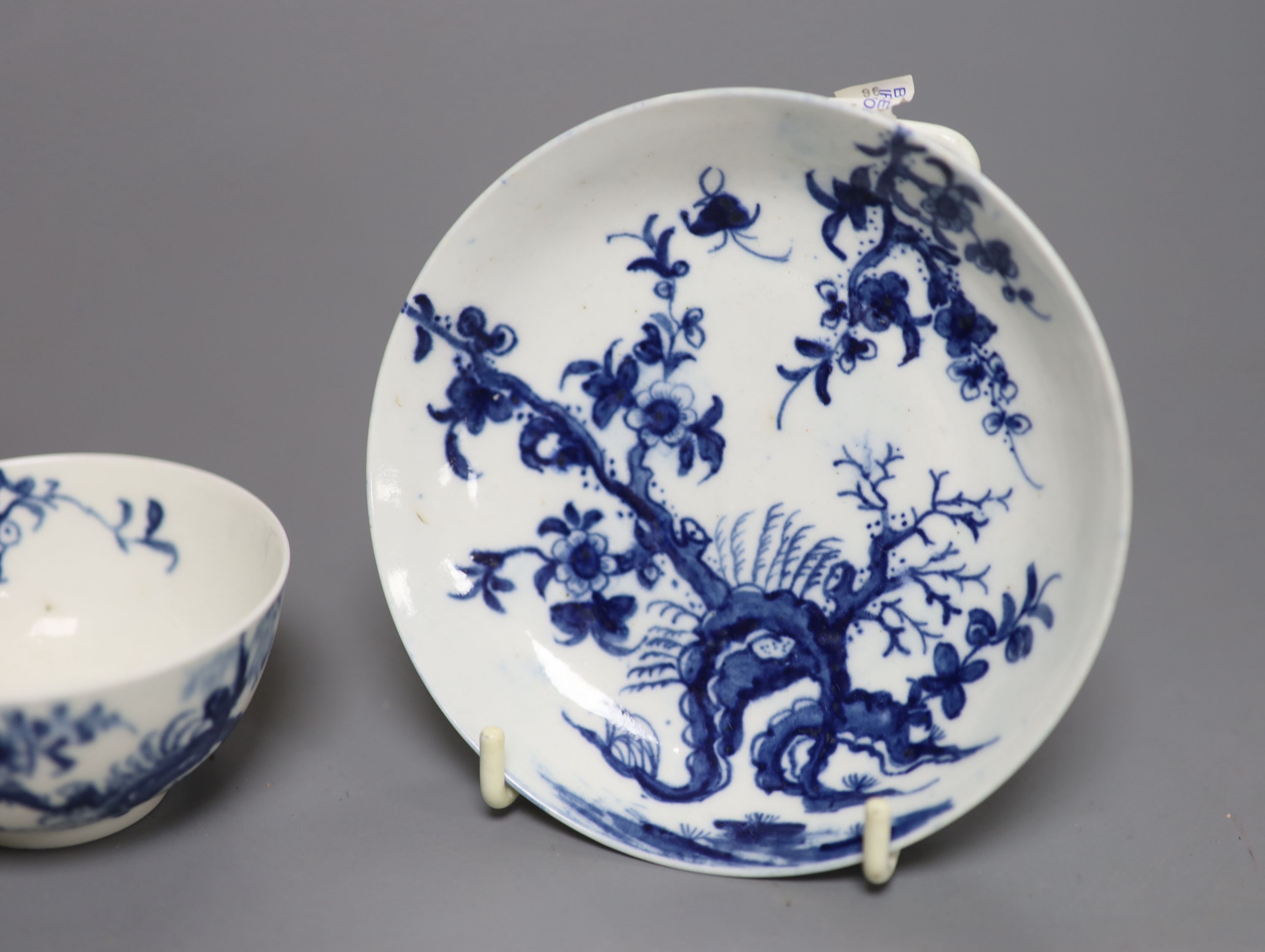 An 18th century Worcester prunus root pattern tea bowl and saucer, diameter 11.5cm, early large crescent mark to both